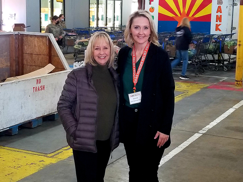 Two Yuma Community Food Bank volunteers