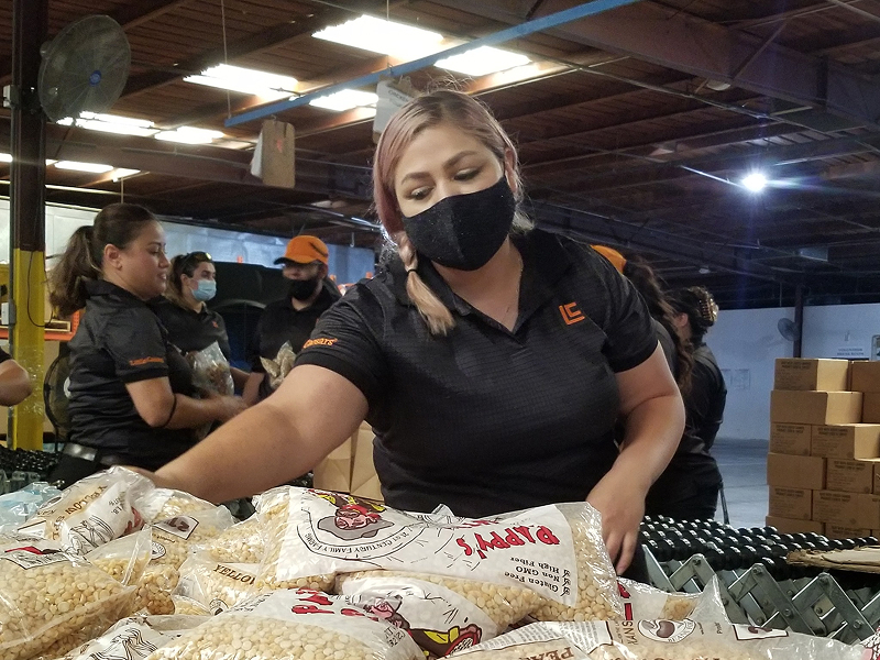 Volunteers packaging food boxes